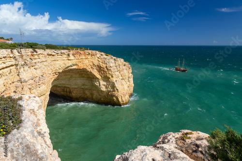 Grotto in the steep coast at the southern coast of the Algarve, Portugal.