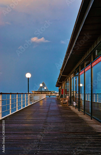 Wooden path on the pier in Heringsdorf in the evening. Baltic Sea island Usedom. Germany