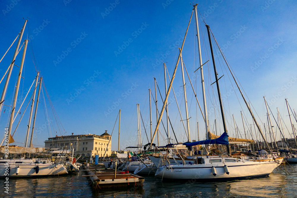 Syracuse, Sicily, Italy The harbour of Ortygia island and sailboats.