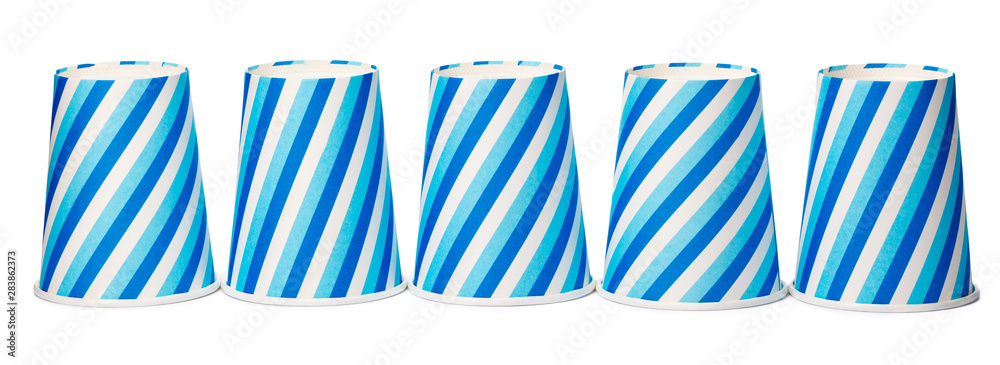 Fototapeta premium Cardboard cups decorated with blue lines pattern isolated on white background