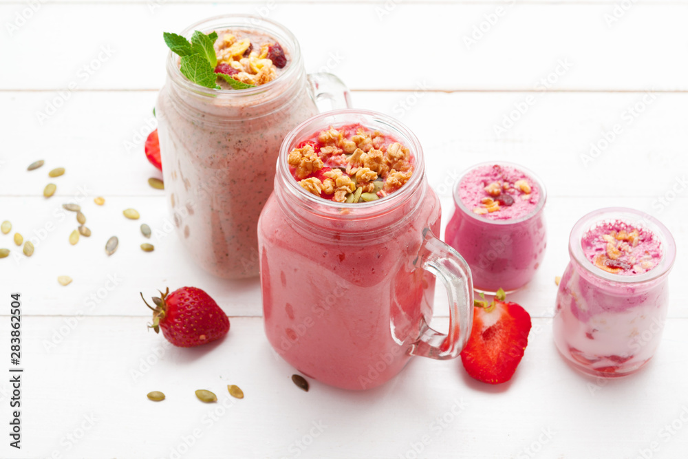 Strawberry with yogurt on white rustic wooden background. Cream dessert Strawberry with yogurt on white rustic wooden background. Cream dessert