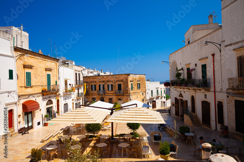 Ostuni  Italy - 12.08.19  old town with restaurants Ostuni is known as the white town.