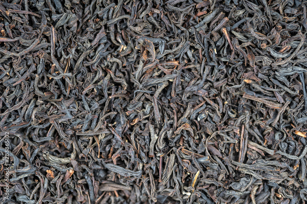 Black tea leaves background. Abstract food textures. Close up Black tea leaves background. Abstract food textures. Close up