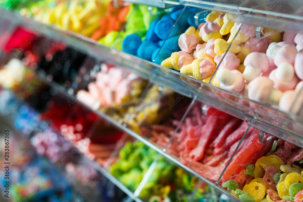 Variety of colored sweets on shelves
