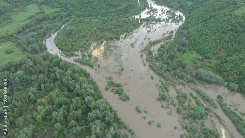 Above overflow of water from river by the forest 4K drone footage Above overflow of water from river by the forest 4K drone footage