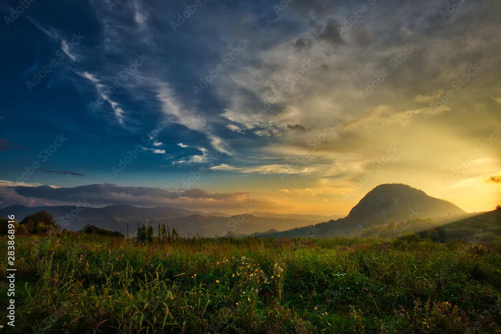Mountain valley during sunset. Natural autumn landscape