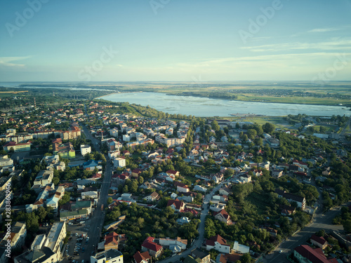 Aerial view of Slatina city and river Olt, Romania. Drone flight over the european city in summer day.