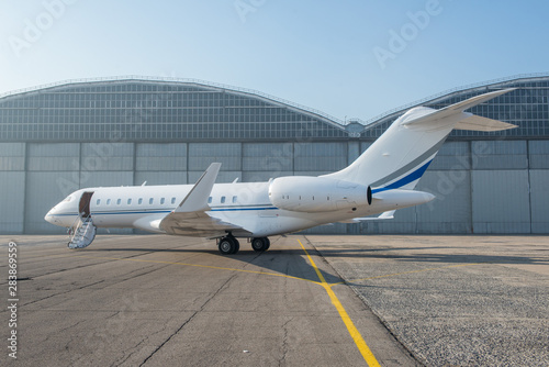 Business jet plane on the ground.