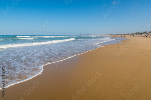 La Barrosa beach  in Sancti Petri  Cadiz  when the tide is low and there is a lot of sand.