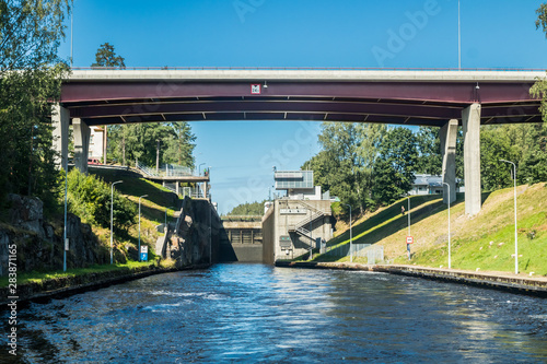 Lappeenranta, Finland - August 7, 2019: Lock and bridge on the Saimaa Canal at Malkia. View from water. photo