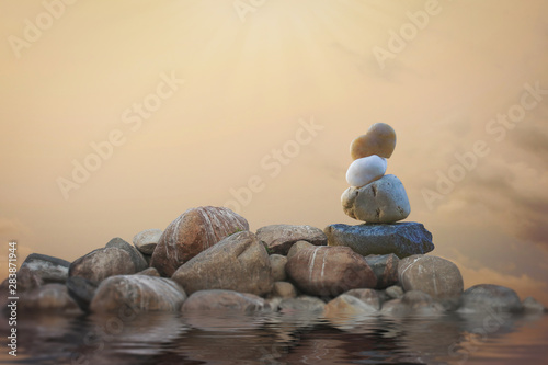 Canvas Print Calming zen rock stack by a lake