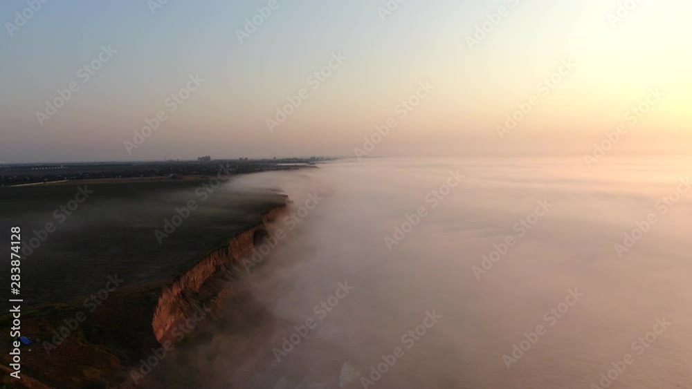 A foggy sunrise on the sea shore A foggy sunrise on the sea shore