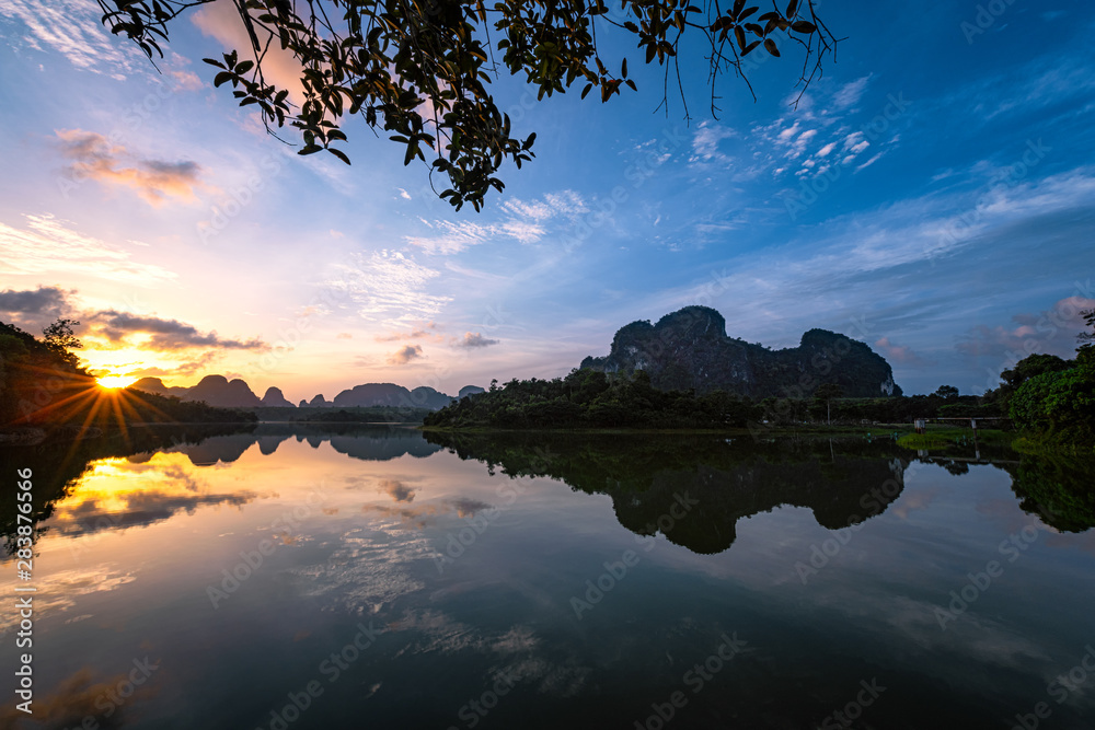 Beautiful nature with sunrise reflection on water Ban Nong Thale, Krabi province, Thailand