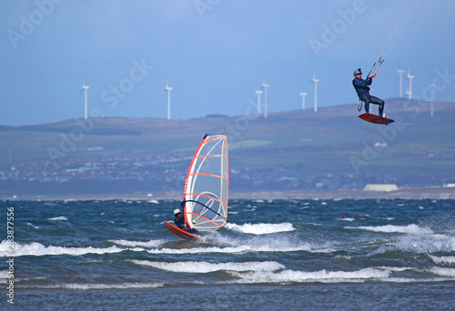 Kitesurfer and windsurfer riding off Barassie Beach, Troon