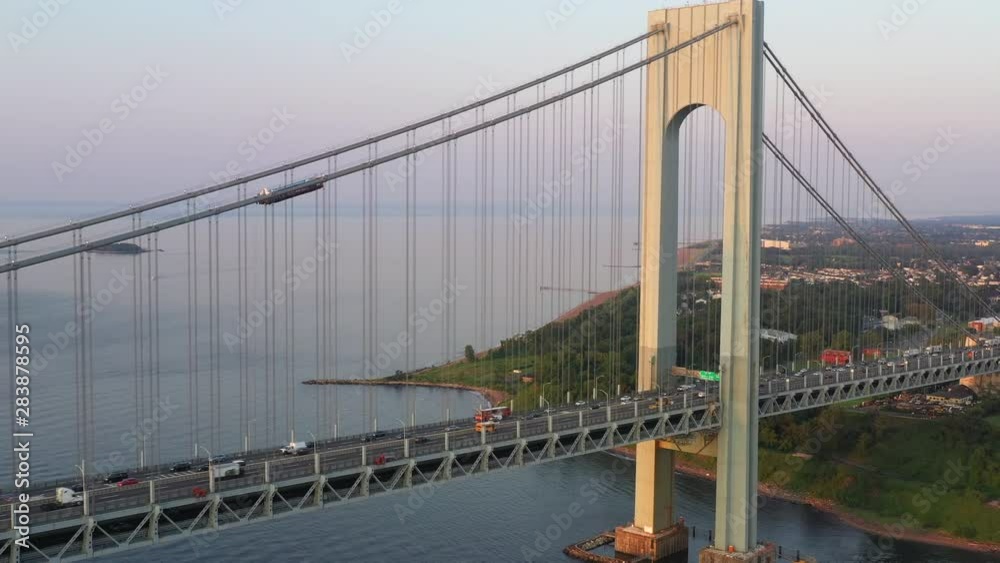 Descending pull back of Verrazano Bridge arch; smooth and simple; 4k