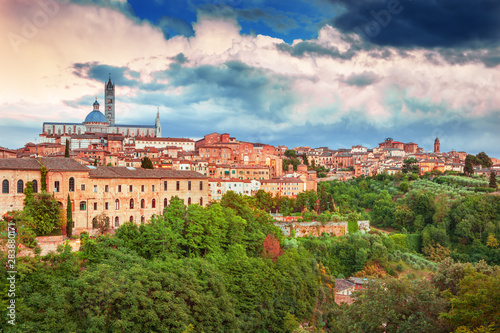 Siena - amazing medieval town at sunset with view of the Dome & Bell Tower of Siena Cathedral (Duomo di Siena), landmark Mangia Tower and Basilica of San Domenico,Italy
