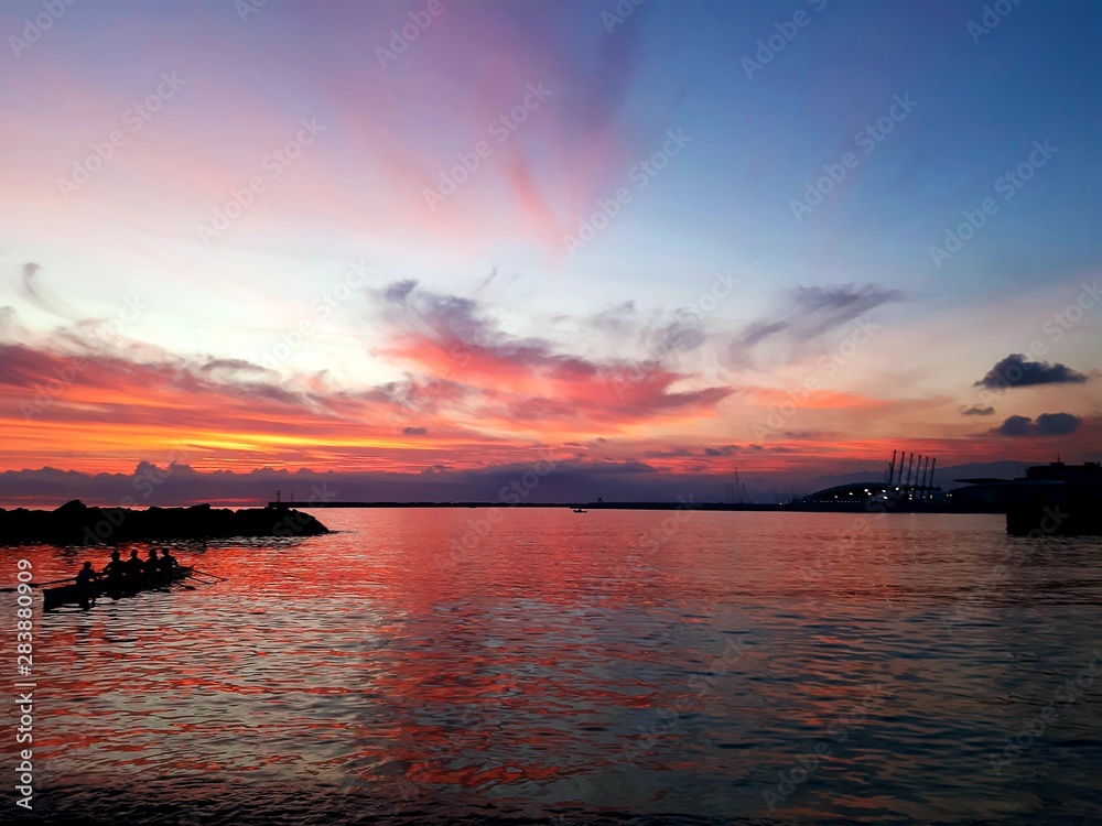 Genova, Italy - 08/12/2019:Sunset horizon sea water landscape. Sunset sea horizon panorama. Orange sunset sea horizon view at sunset