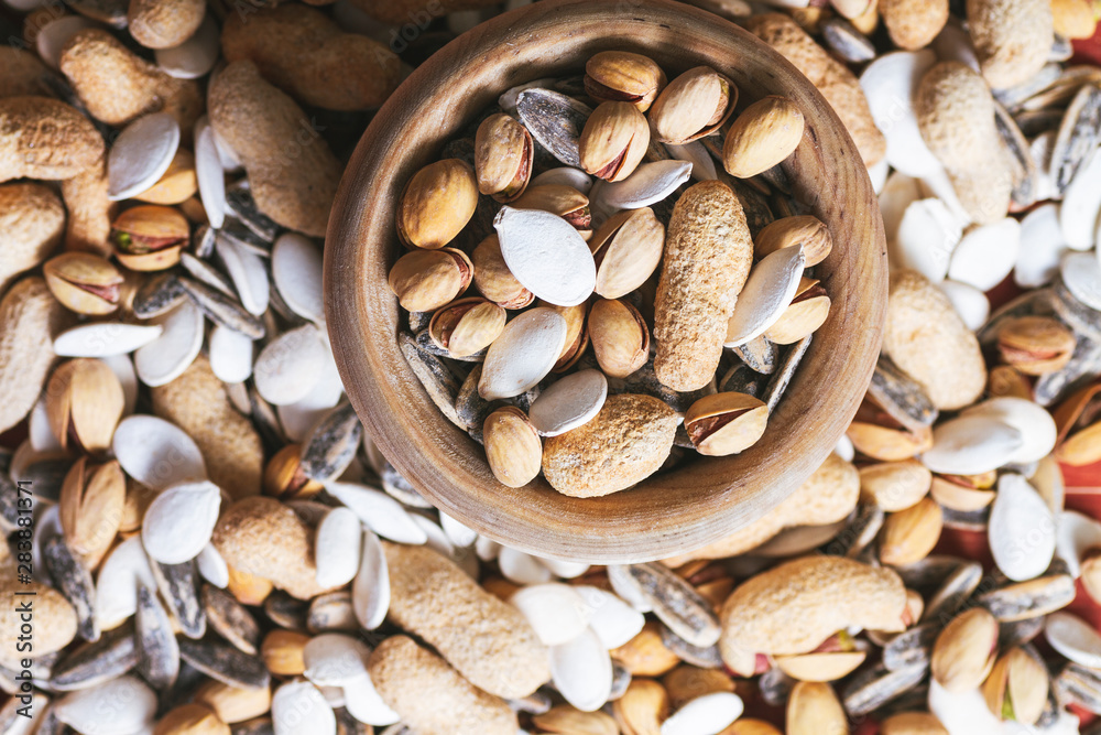 Naklejka premium set of nuts sore wooden background