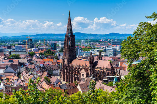 Germany, Red roofs and historical gothic muenster cathedral in famous student city freiburg im breisgau from above, no scaffolding in 2019