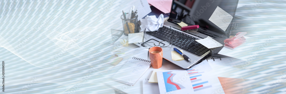 Messy and cluttered desk; panoramic banner Messy and cluttered desk; panoramic banner