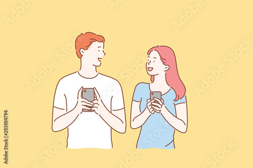 Concept of a young couple in love excited man and woman smiling. Boy and Girl meet or talk, both using mobile phones. Cartoon flat Design Isolated Vector illustration