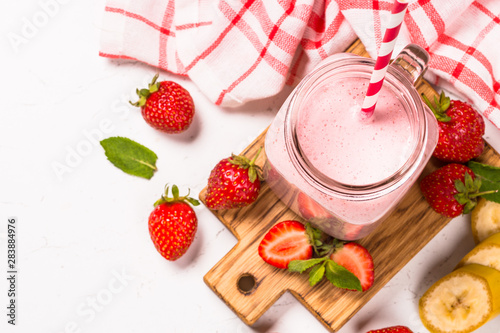 Strawberry milkshake or smoothie in mason jar.
