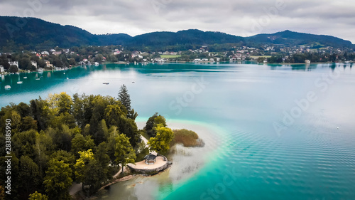 Aerial view of lake Worthersee in Portschach Am Worthersee town 