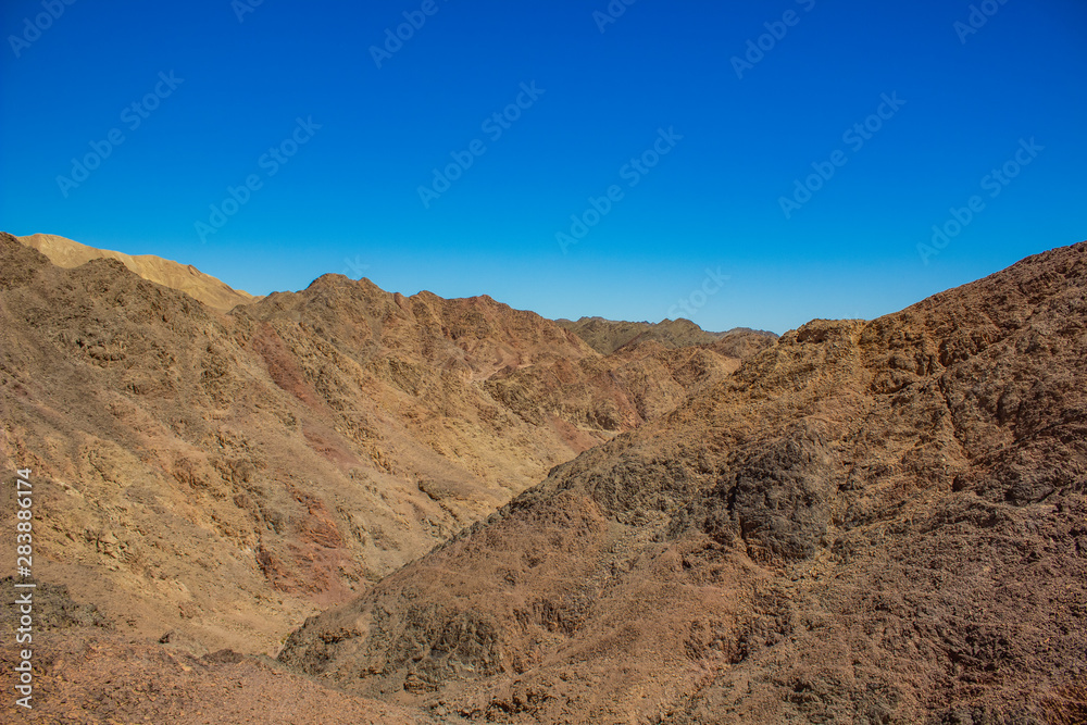 dry desert scenic landscape wilderness and dangerous rocky mountains wasteland environment with nothing and nobody 