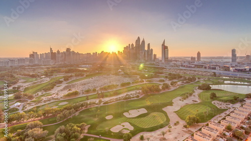 Canvas Print Dubai Marina skyscrapers and golf course sunset timelapse, Dubai, United Arab Em