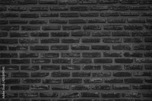 Abstract Wall black brick wall texture background pattern, brick surface backgrounds. Vintage Brickwork or stonework flooring interior rock old clean concrete grid uneven, wall bricks design.