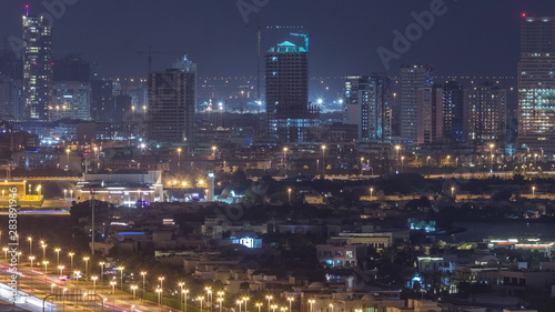 Aerial view to villas and houses with Golf course night timelapse