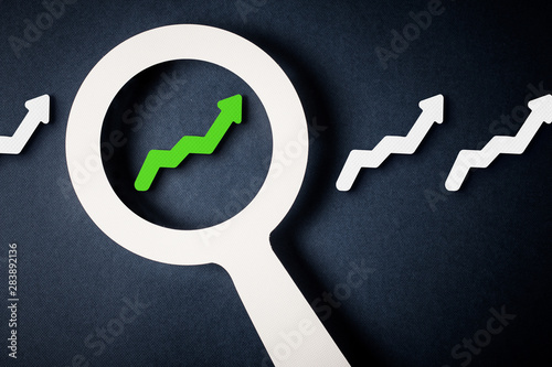 Checking chart with magnifying glass
