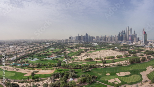 Dubai Marina skyscrapers and golf course morning timelapse, Dubai, United Arab Emirates photo