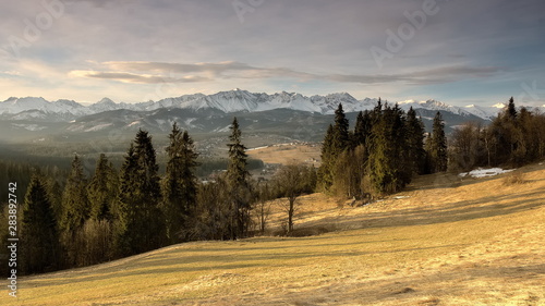 Warm sunrise in the mountains at winter time.