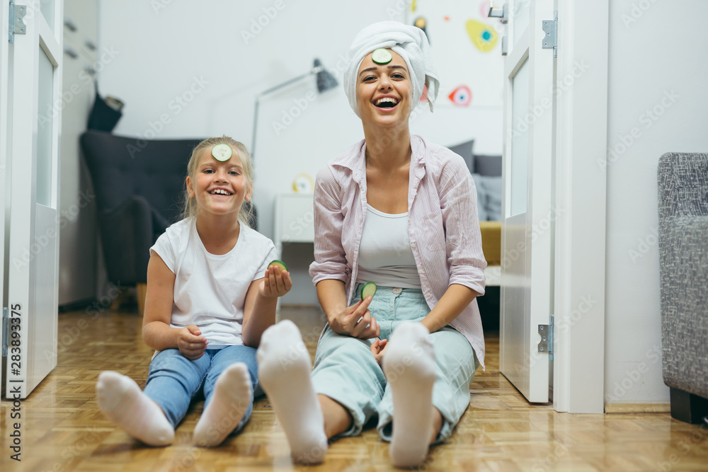happy family time. mother and daughter skin treatment at home happy family time. mother and daughter skin treatment at home