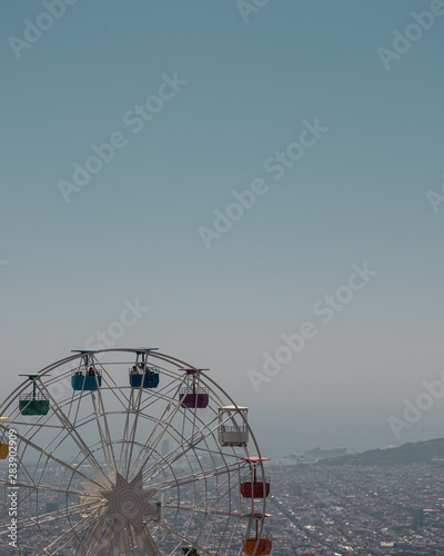 Ferris wheel on blue sky