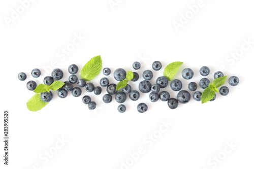 blueberry and mint leaves on a mulberry background top view. Berries.