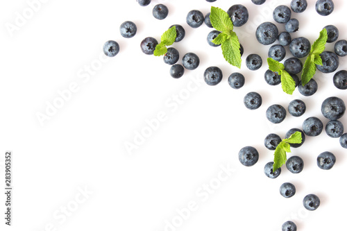 blueberry and mint leaves on a mulberry background top view. Berries.