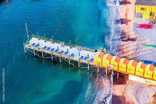 Beach huts and jetty in Sorrento, Campania, Italy photo