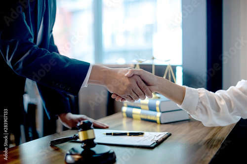 Lawyer or judge  with gavel and balance handshake photo