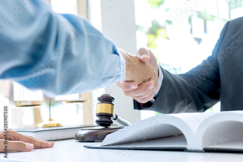 Lawyer or judge  with gavel and balance handshake photo
