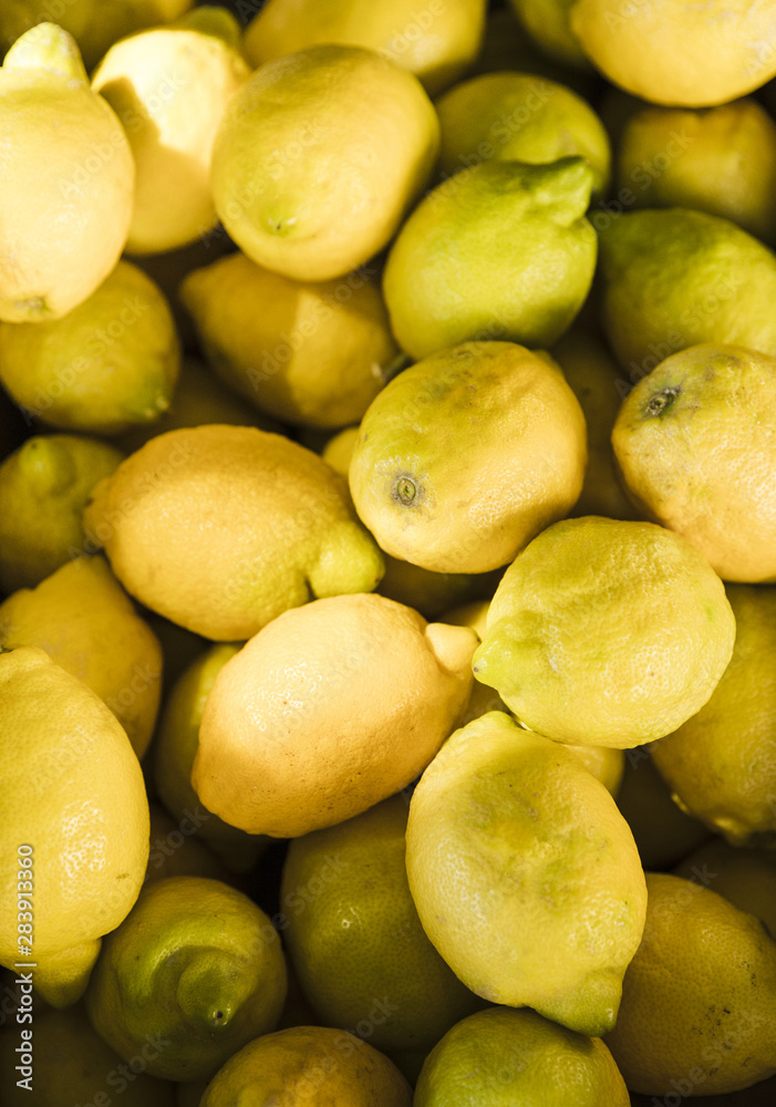 Display of fresh organic yellow lemons in fruit market Display of fresh organic yellow lemons in fruit market