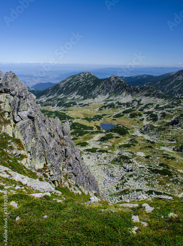Mountain landscape and glacial lake in Retezat National Park, Carpathian Mountains, Romania