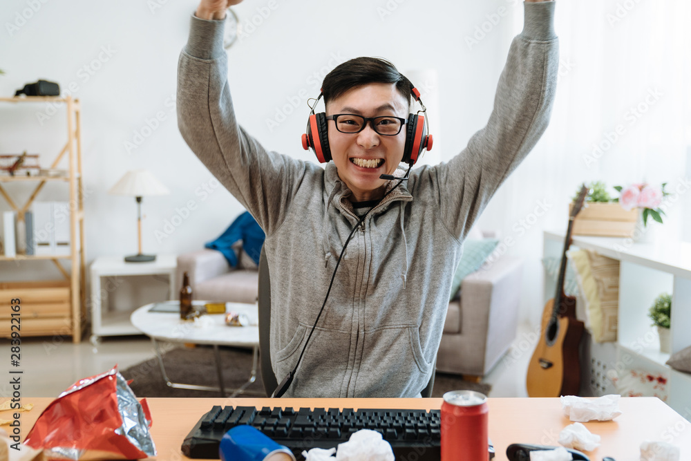 Chinese Boyfriend And Girlfriend Playing Video Games Sitting At