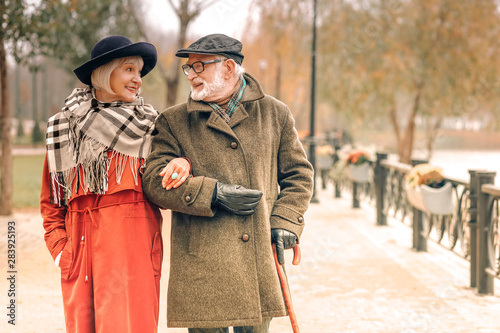 Elderly couple taking a walk in park