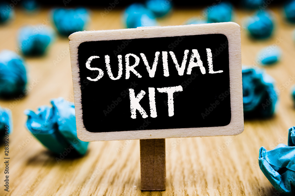 Handwriting text Survival Kit. Concept meaning Emergency Equipment  Collection of items to help someone Blackboard crumpled papers several  tries mistake not satisfied wooden floor Stock Photo
