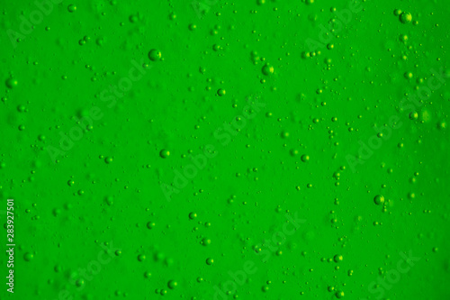 Macro Oxygen bubbles in water on a green background, concept such as ecology and other uplifting successful projects