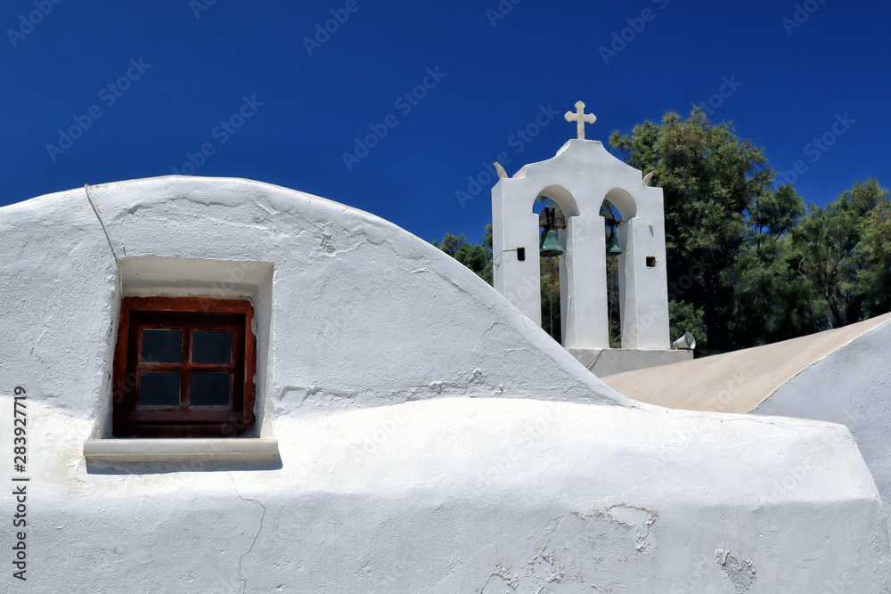 White Greek church bell tower and window architecture, Naxos town, Greek Islands