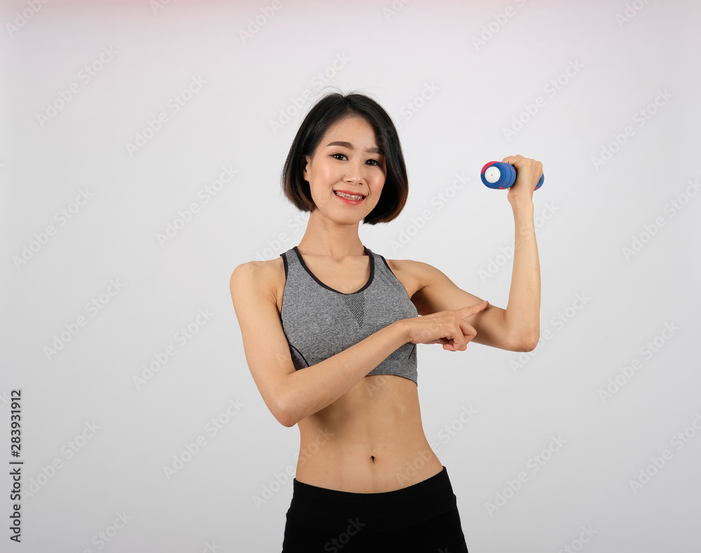 sporty woman in sportswear with dumbbell doing fitness workout on white background. healthy sport lifestyle sporty woman in sportswear with dumbbell doing fitness workout on white background. healthy sport lifestyle
