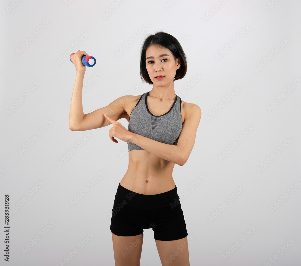 sporty woman in sportswear with dumbbell doing fitness workout on white background. healthy sport lifestyle sporty woman in sportswear with dumbbell doing fitness workout on white background. healthy sport lifestyle